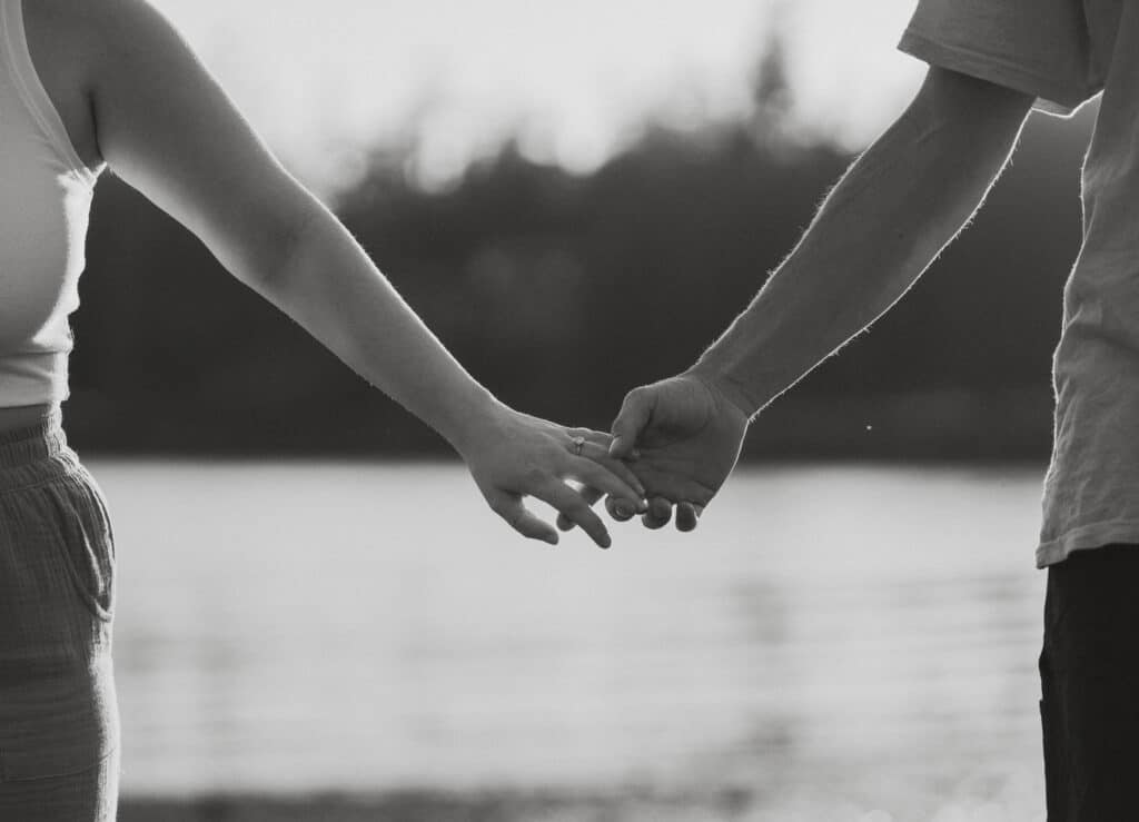 Couple holding hands during couples session in Ucluelet