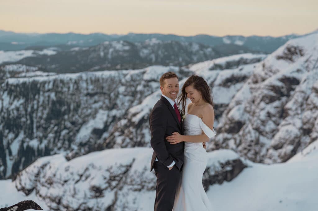 Couple in warm embrace during helicopter elopement on Vancouver Island