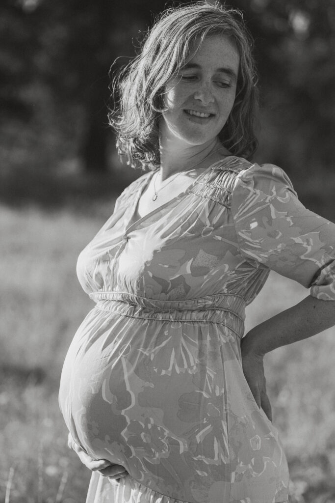 Expecting mother in a field of tall grasses in Comox by Latitude 49 photography