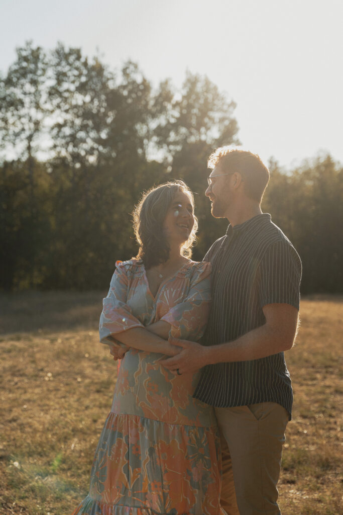 Expecting parents in a field of tall grasses in Comox by Latitude 49 photography