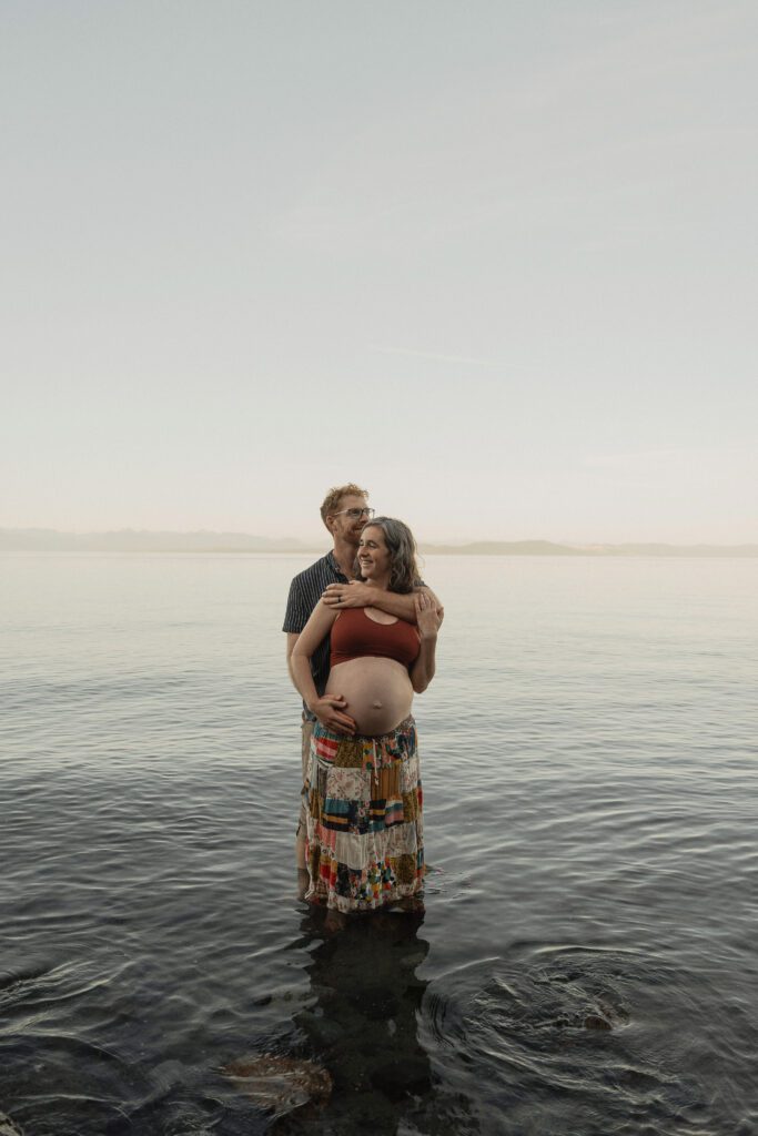 Expecting mother on the beach in Comox by Latitude 49 photography