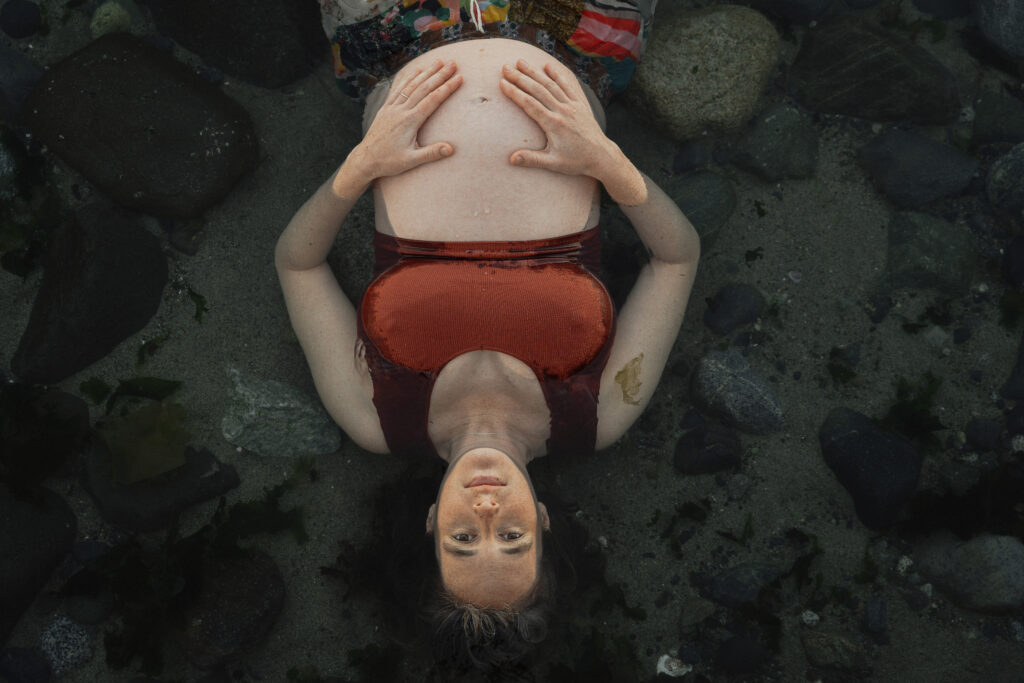 Expecting mother on the beach in Comox by Latitude 49 photography