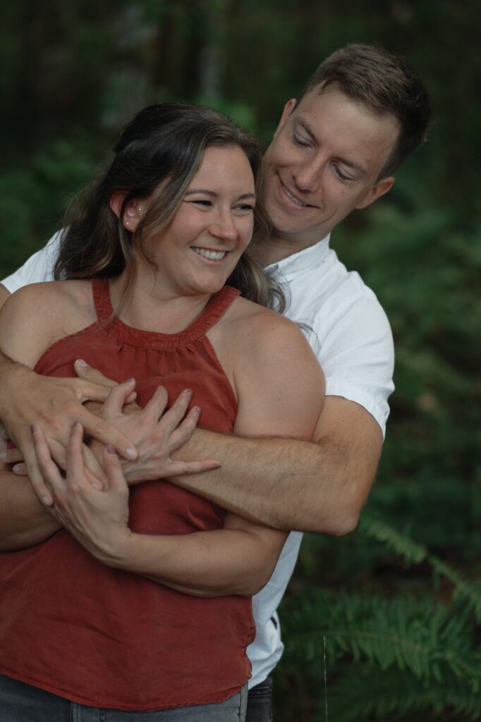 Couple in the forests of Seal Bay during their engagement session by latitude 49 photography
