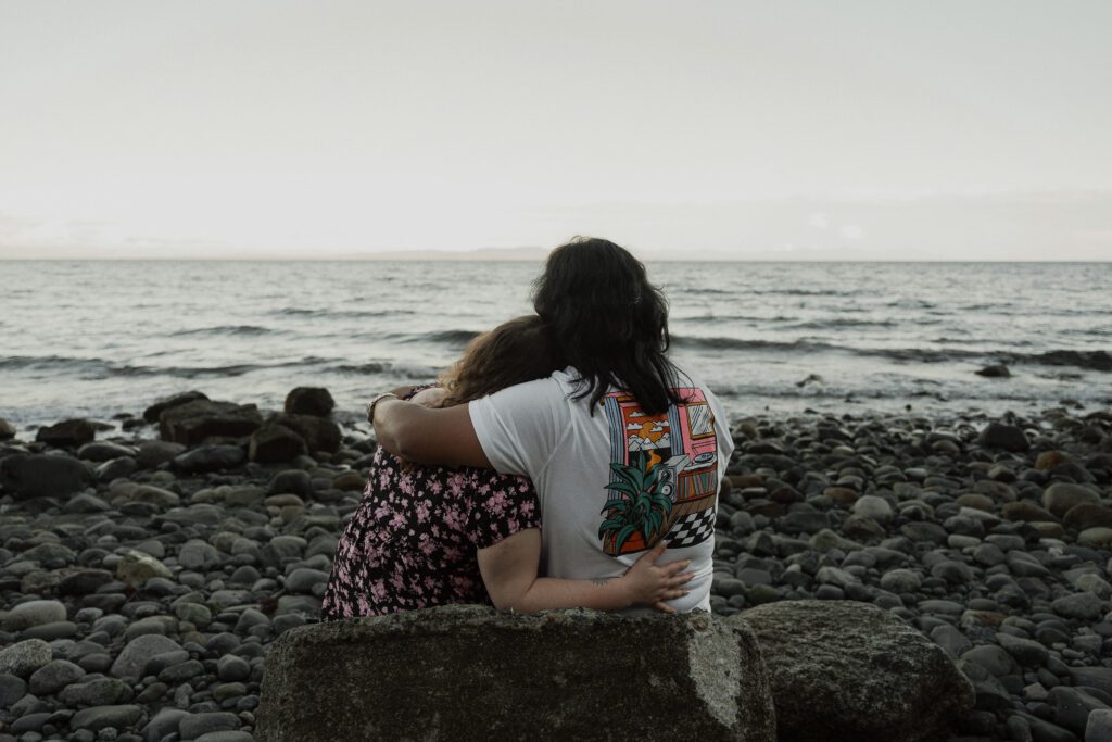 Couple during their golden hour engagement session at Kye bay in Comox by latitude 49 photography