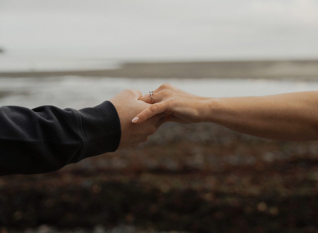 Couple during their engagement session near Kye Bay in Comox by Latitude 49 Photography