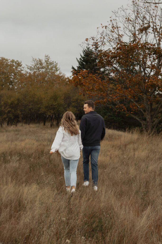 Couple during their engagement session near Kye Bay in Comox by Latitude 49 Photography
