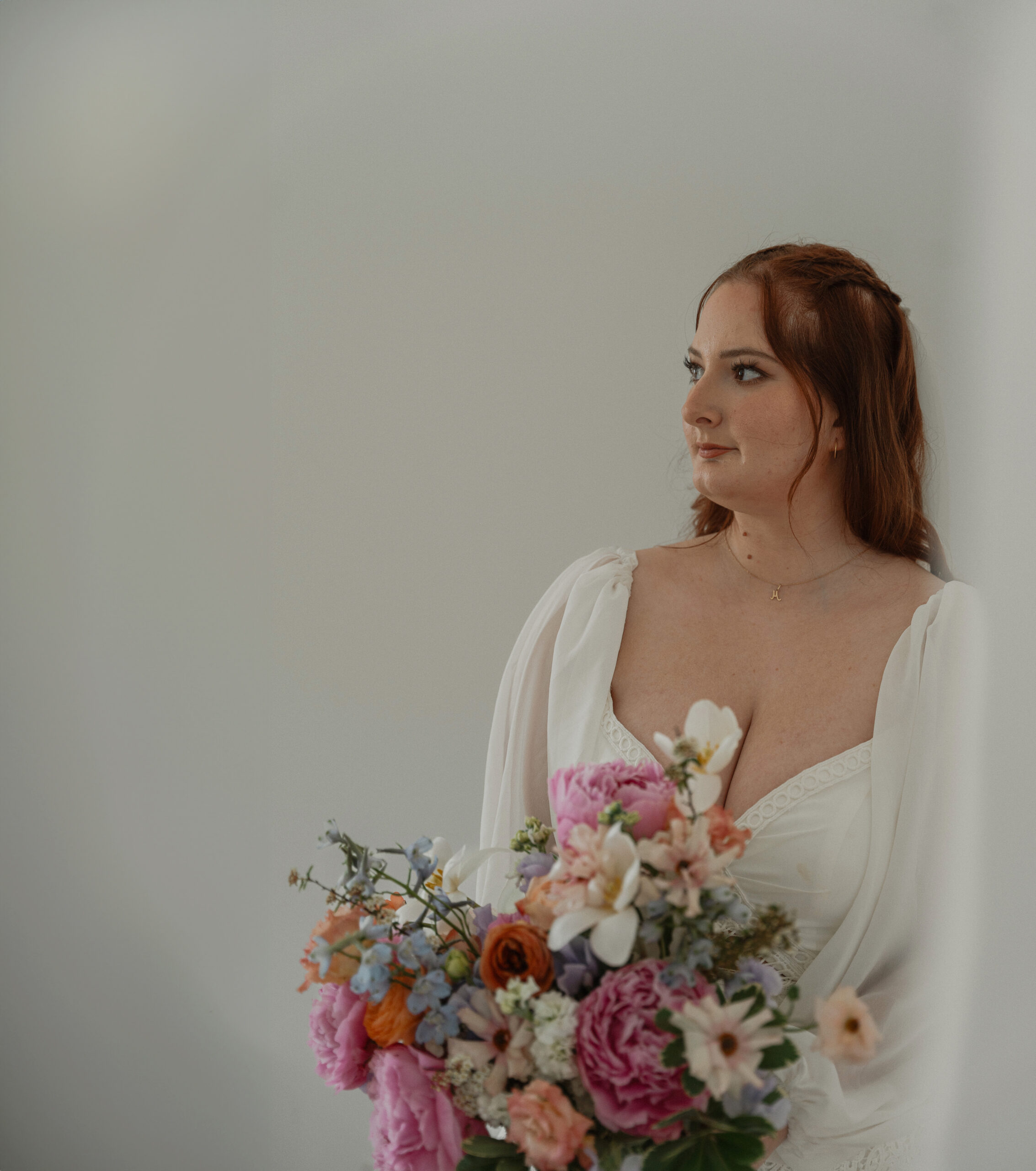 Bride at wild west coast retreats with bouquet by roo florals in Ucluelet by latitude 49 photography