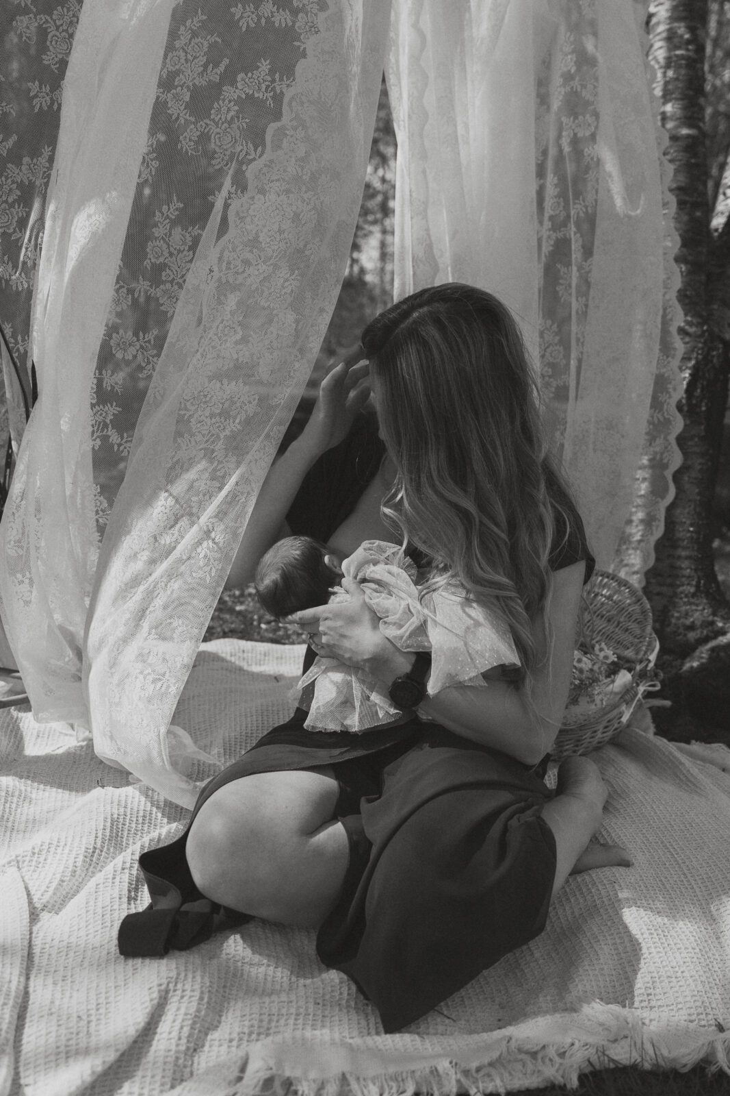 Relaxed candid moments between new mom and baby captured outdoor