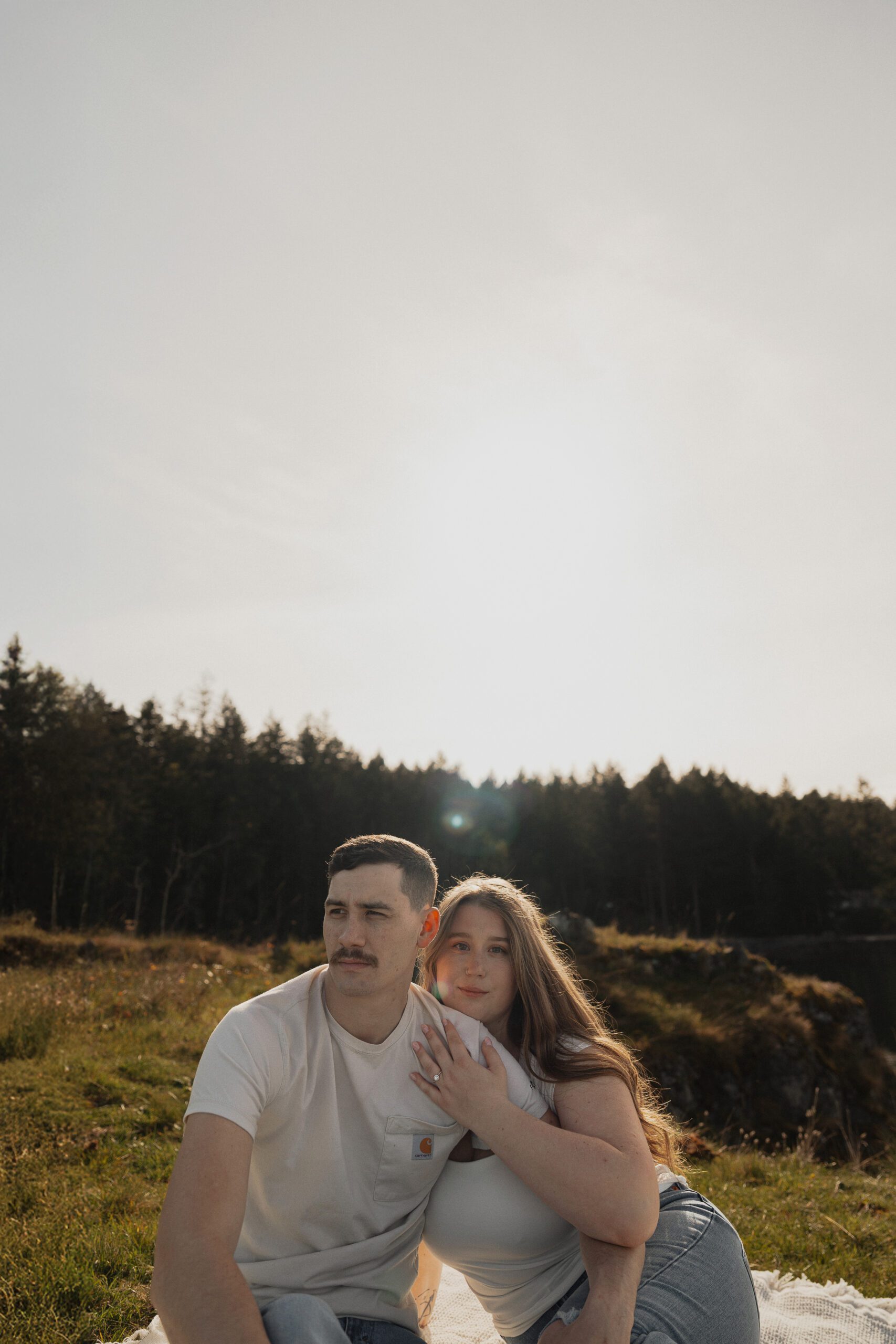 couple during their engagement session at Es-hw Sme~nts Community Park in Nanoose bay by Latitude 49 Photography