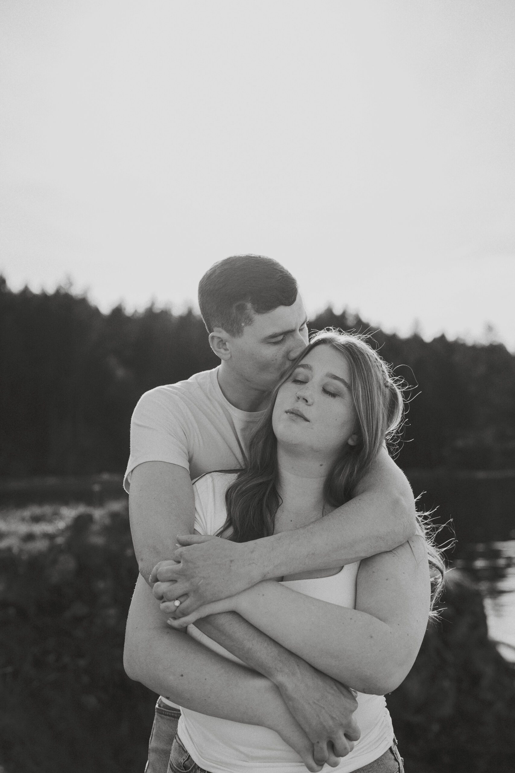 couple during their engagement session at Es-hw Sme~nts Community Park in Nanoose bay by Latitude 49 Photography