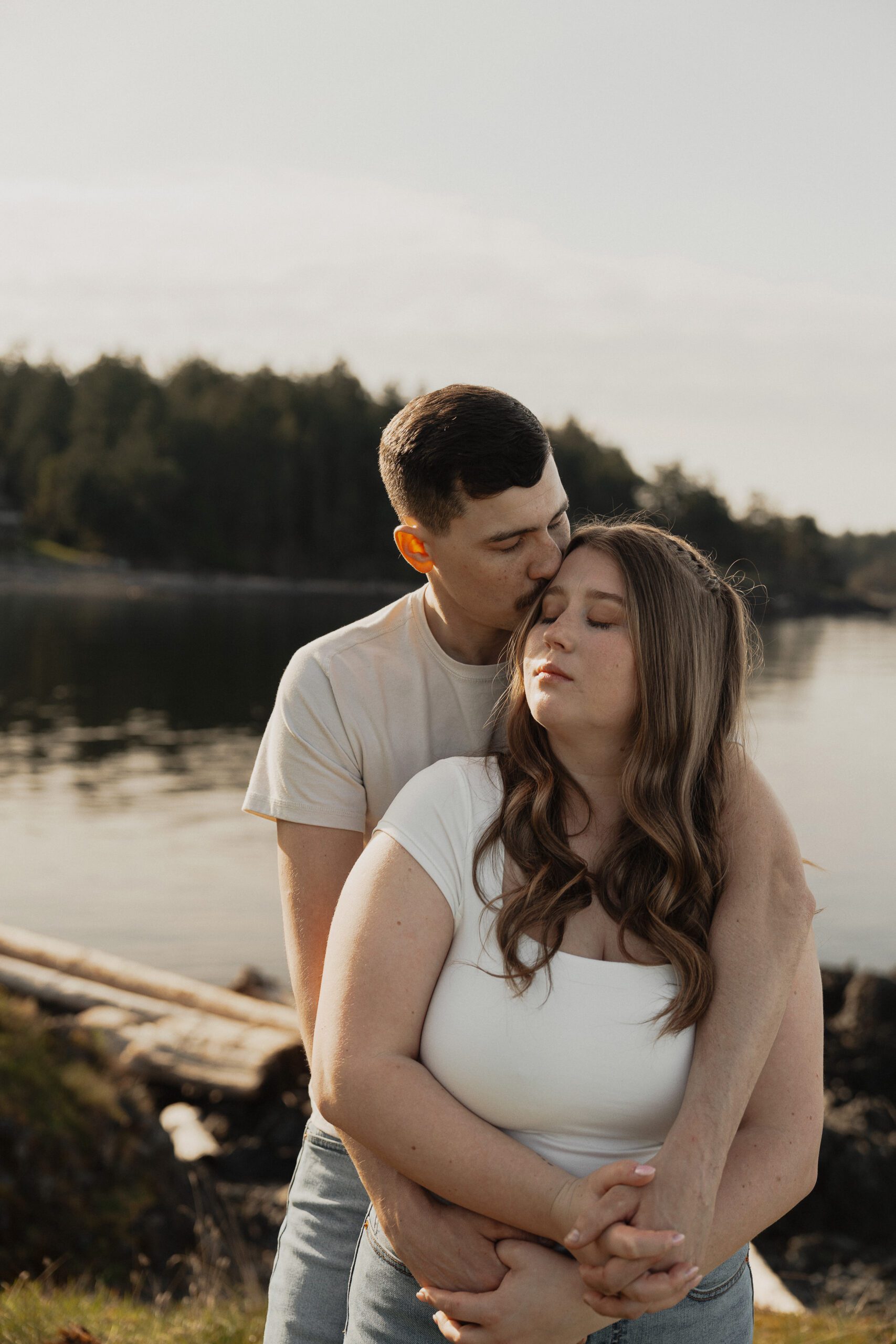 couple during their engagement session at Es-hw Sme~nts Community Park in Nanoose bay by Latitude 49 Photography