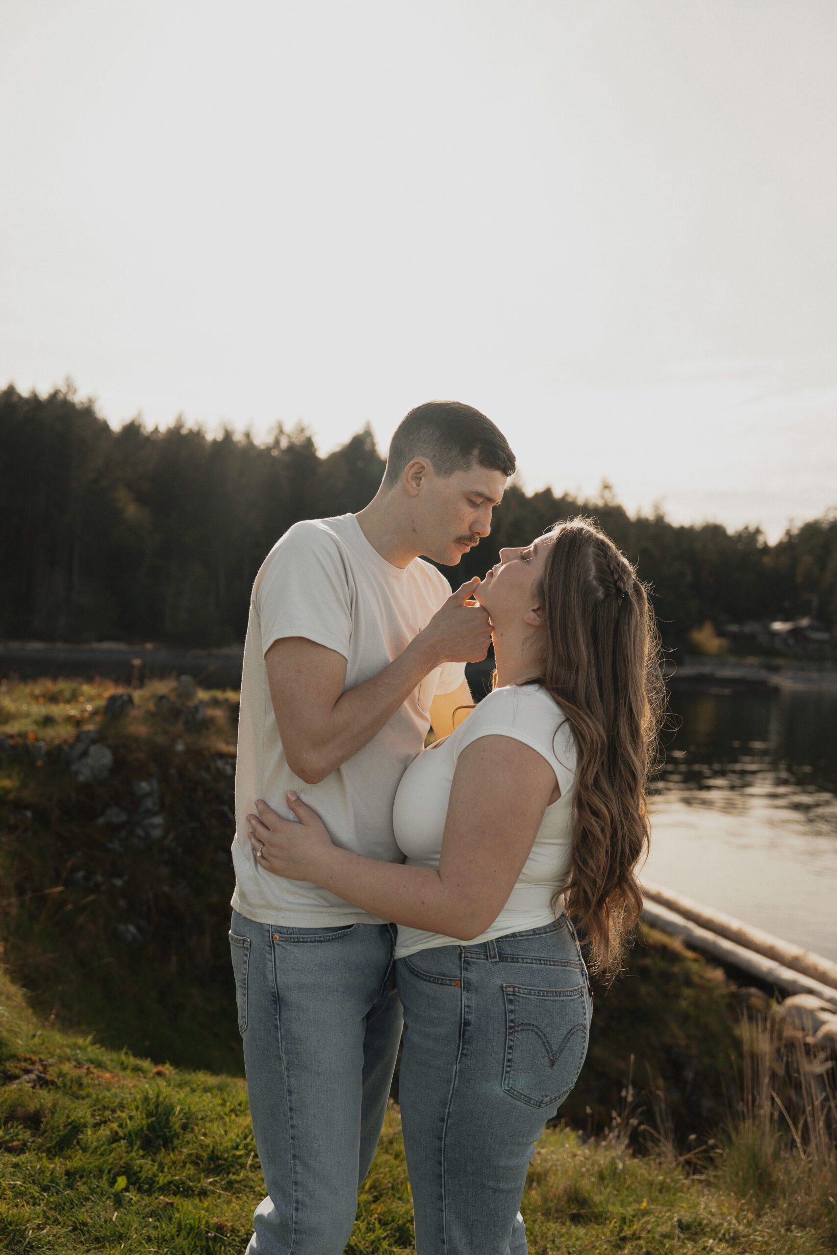couple during their engagement session at Es-hw Sme~nts Community Park in Nanoose bay by Latitude 49 Photography