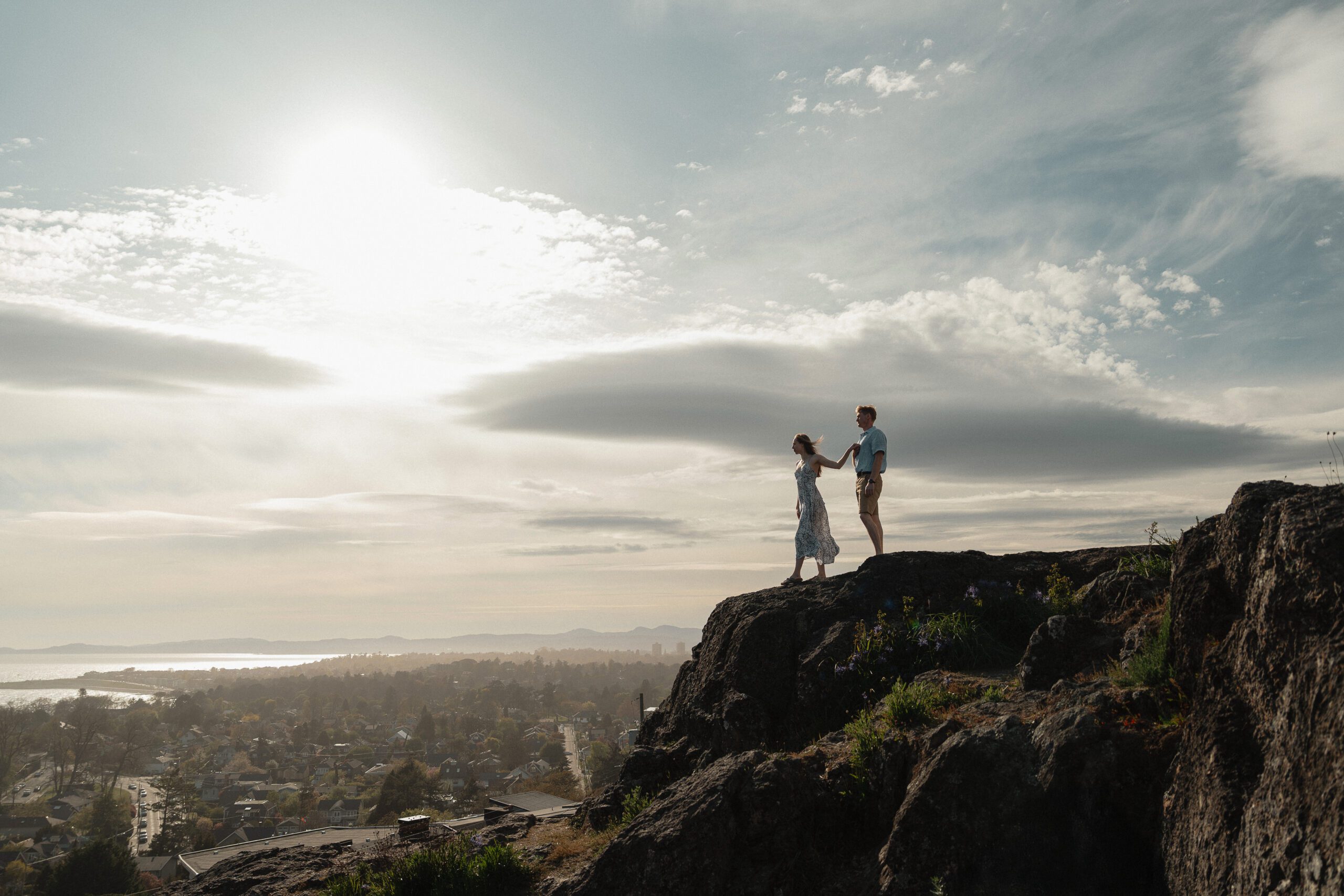 Couple on a rocky mountain side at Gonzales Observatory in Victoria by Latitude 49 photography
