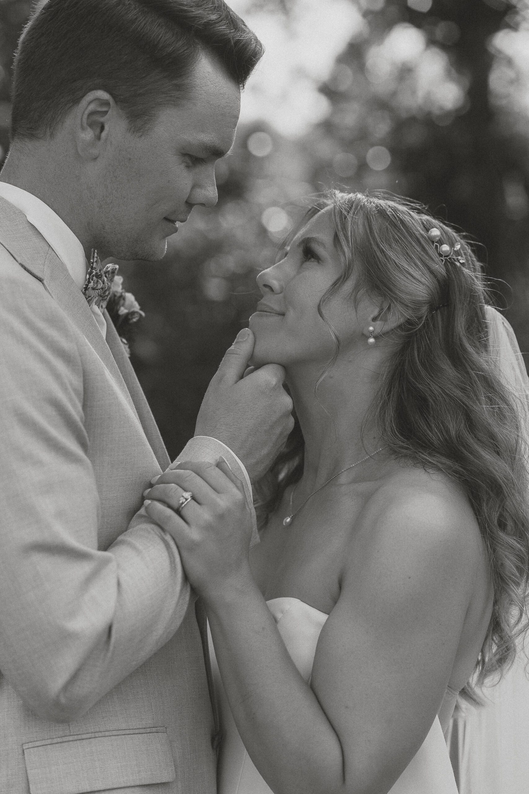 Couple getting ready to kiss during their wedding portraits by Latitude 49 Photography