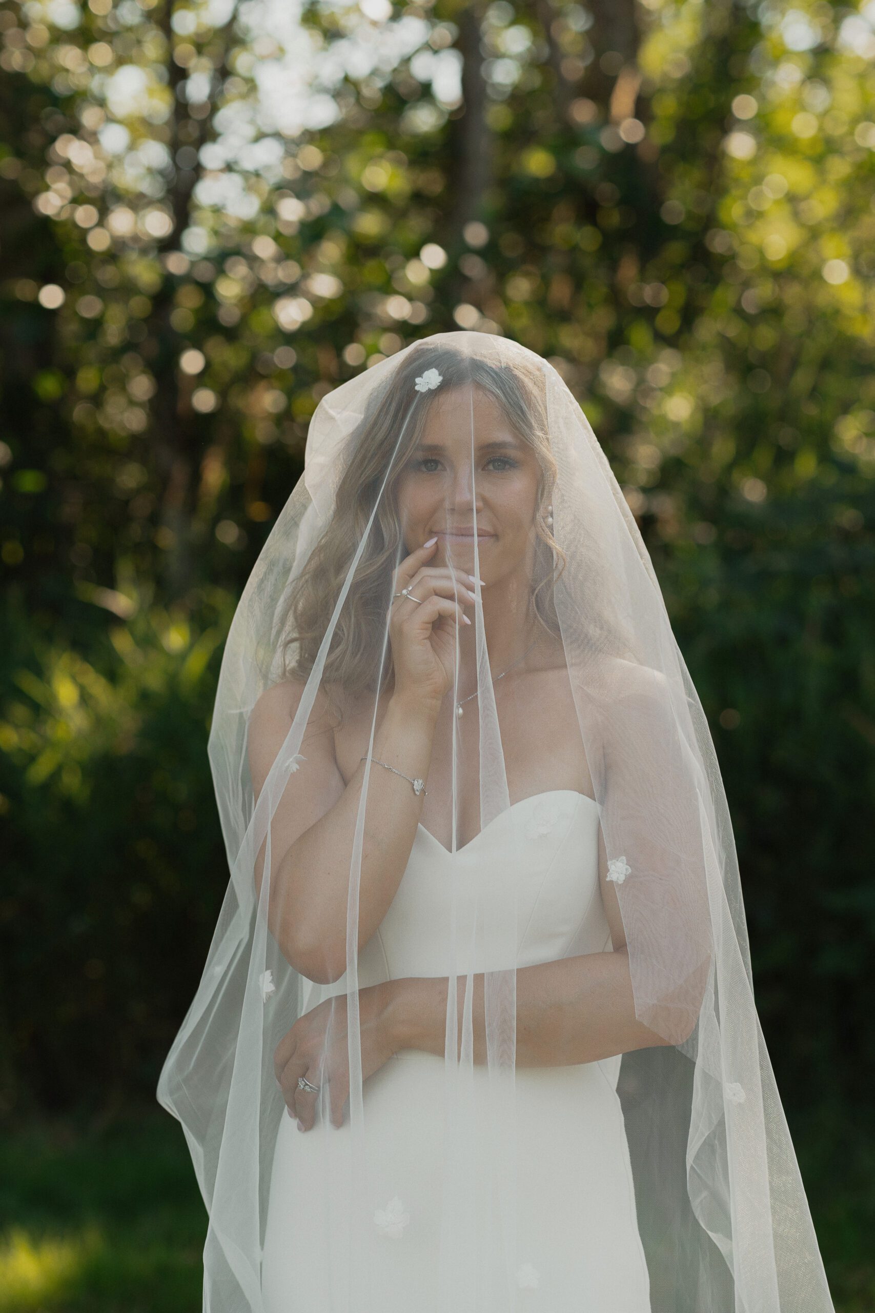 Bride under the veil during her wedding portraits in Comox by Latitude 49 Photography
