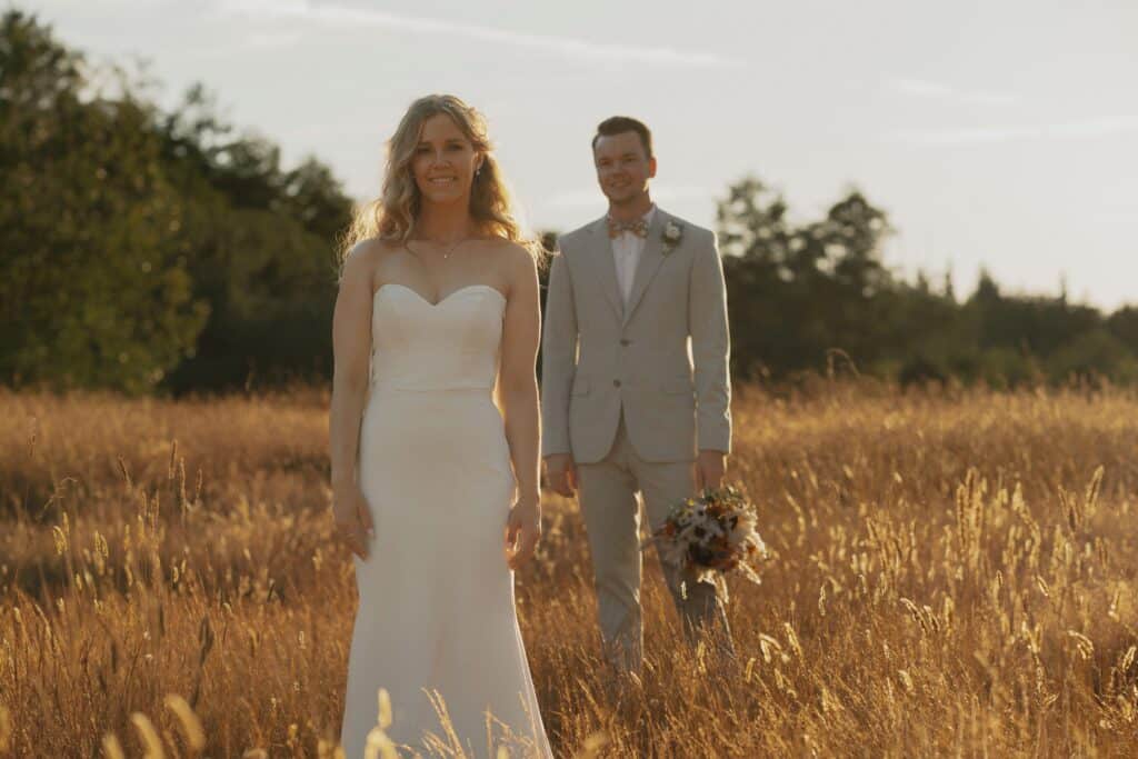 groom looking at bride at golden hour during wedding portraits in Comox by latitude 49 Photography