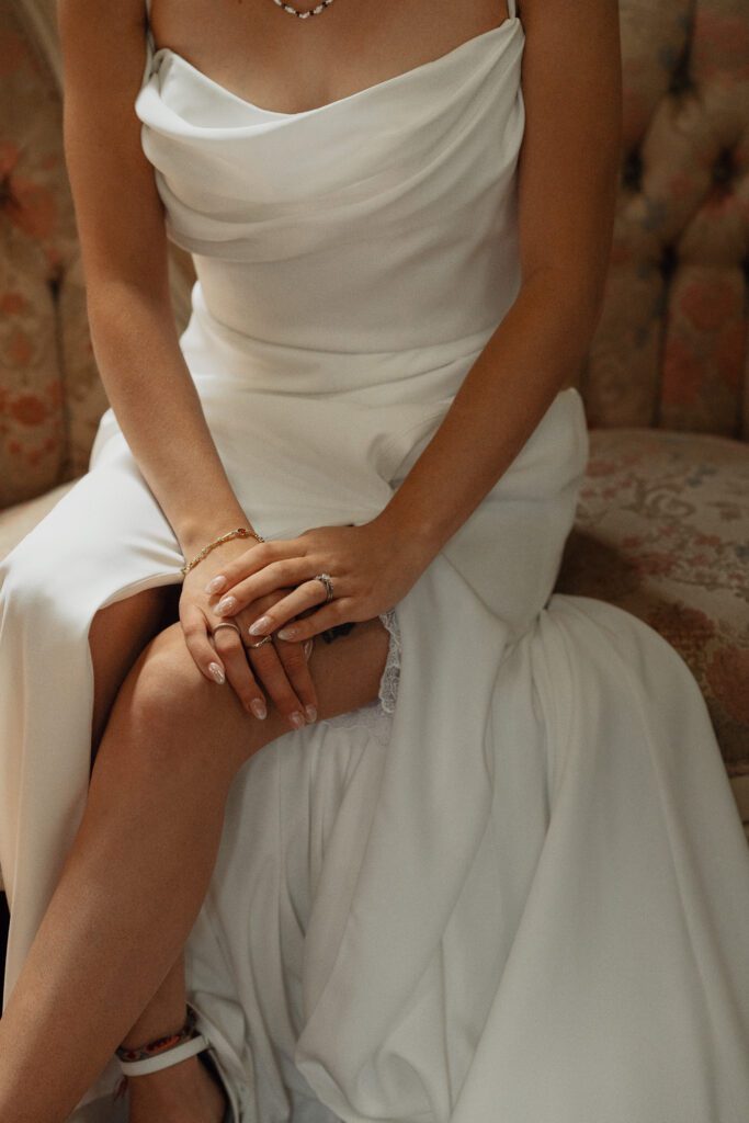 Bride sitting on vintage settee during getting ready portraits at Caleb Pike Heritage Park in Victoria 