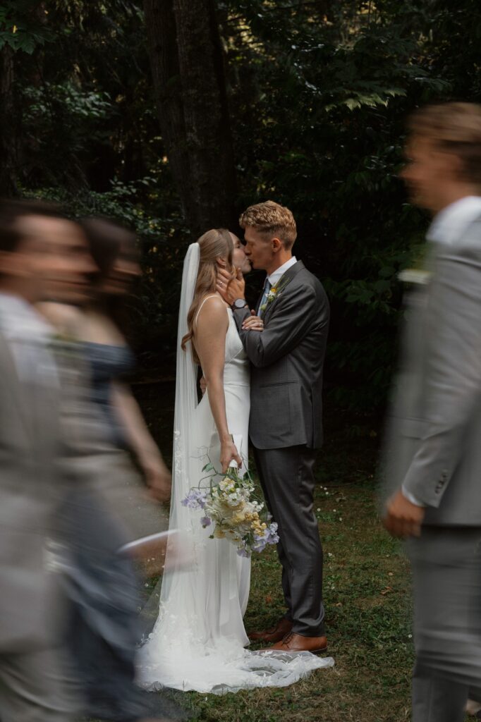 Bride and groom with their wedding party on their wedding day at heritage acres in saanichton by latitude 49 photography