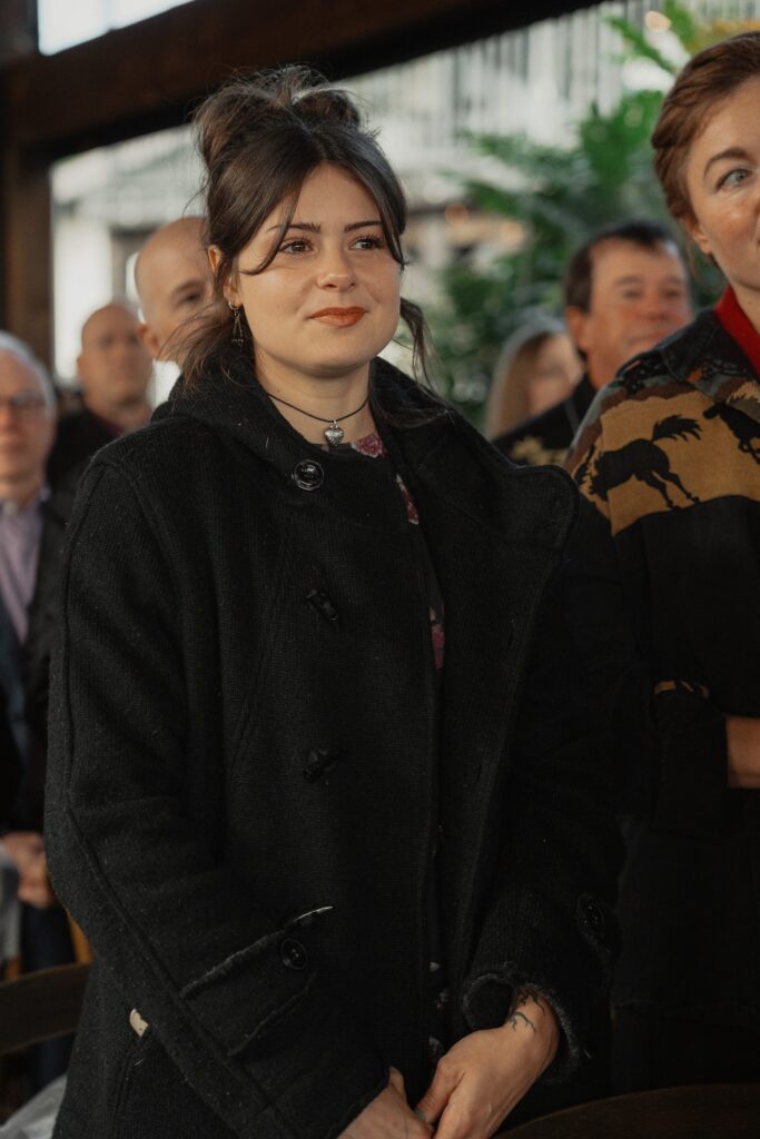 Guests watching bride walk down the isle