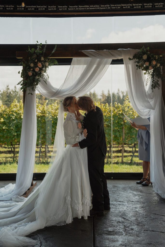 bride and grooms first kiss