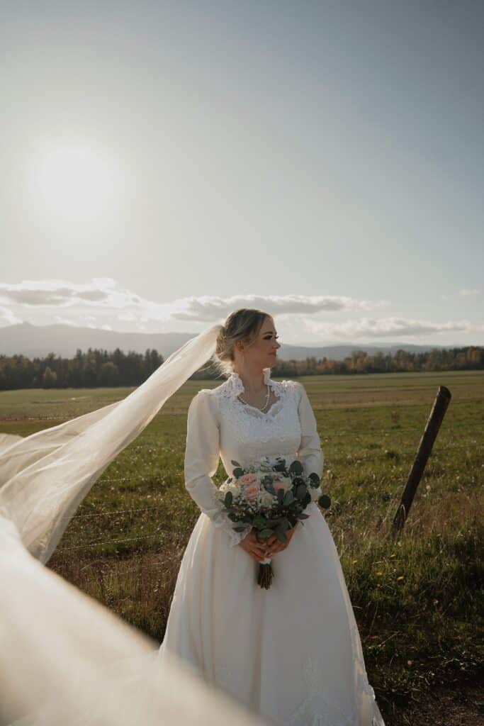 bride with flowing veil during portraits