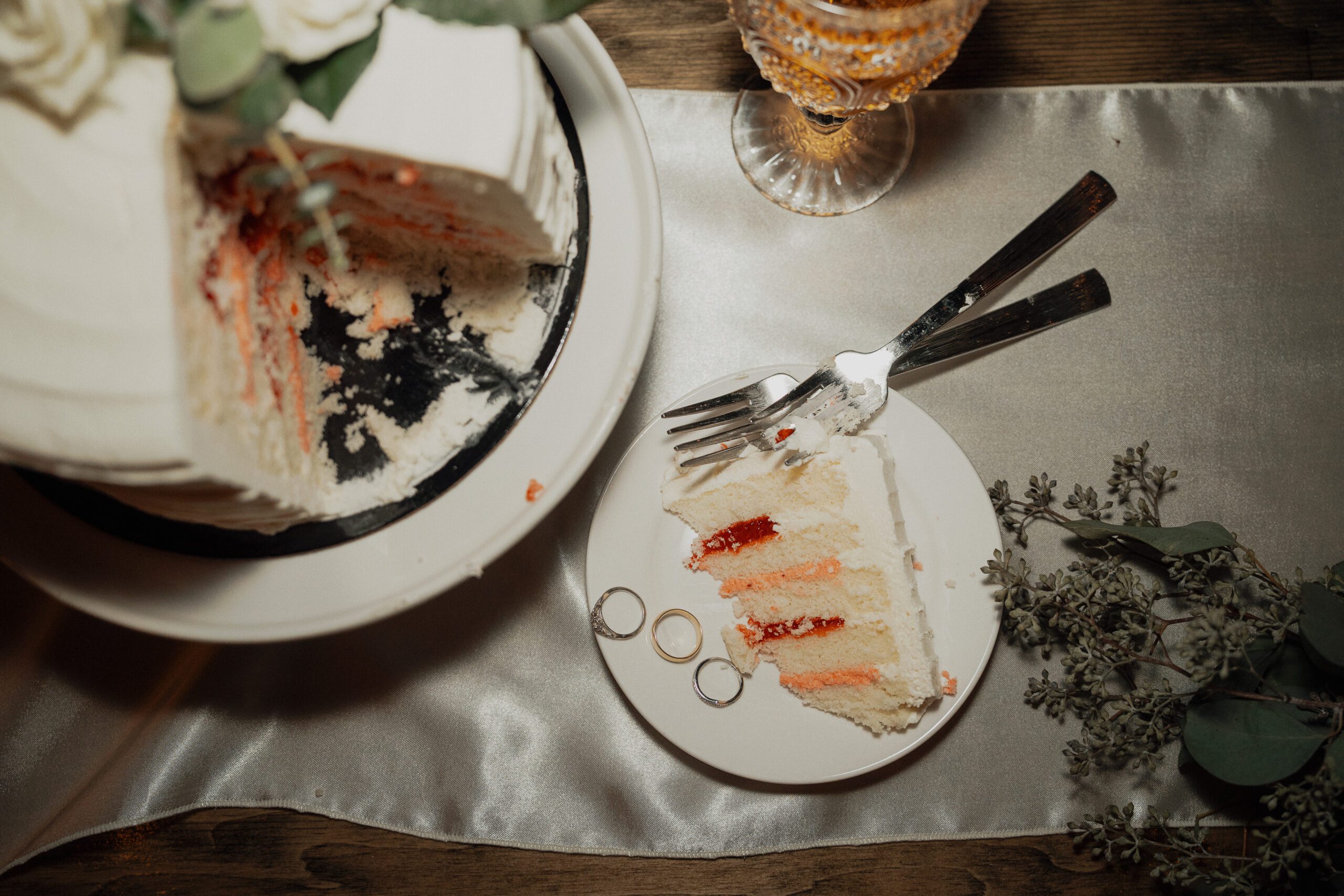 details photo of cake and rings during a wedding after cake cutting at 40 knots bakery by Latitude 49 photography