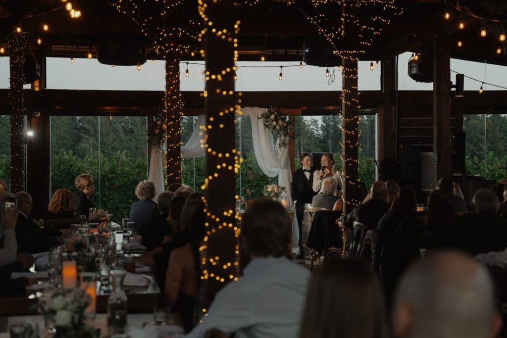 Bride and groom giving a speech at their wedding