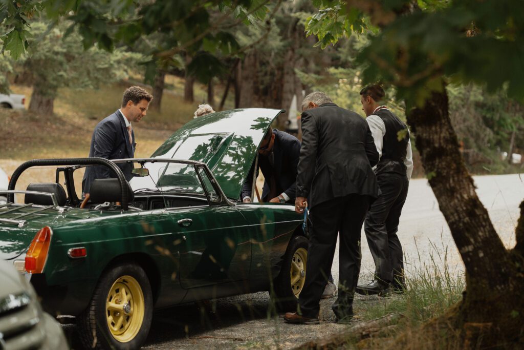 Groom fixing MGB at Caleb Pike Heritage Park in Victoria by Latitude 49 Photography