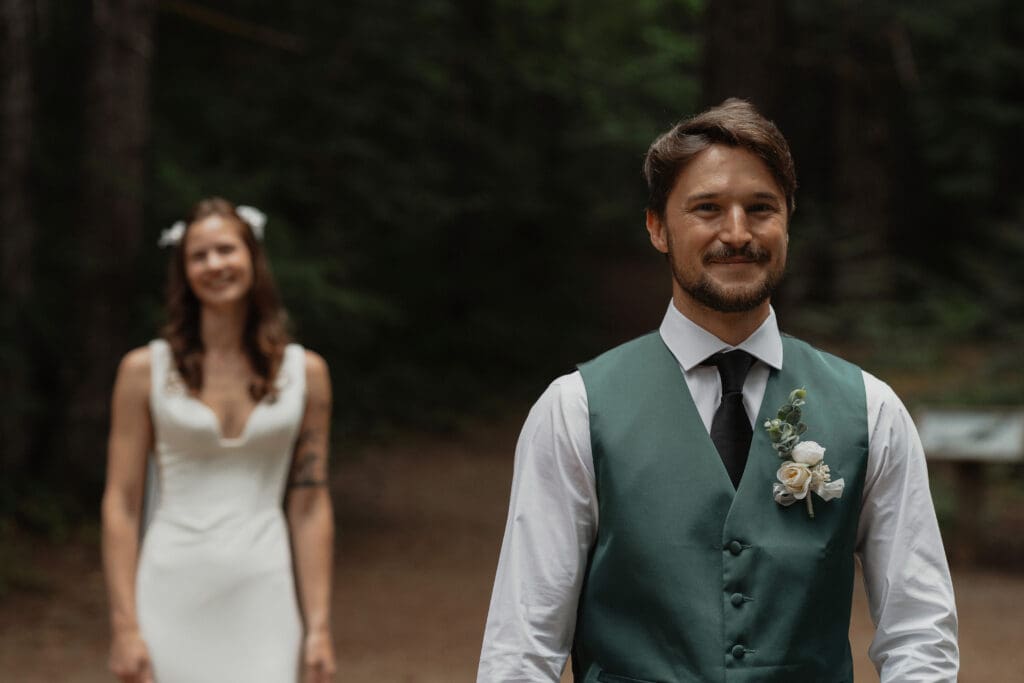 Bride and Groom during their first look at Nymph falls in Courtenay by Latitude 49 Photography