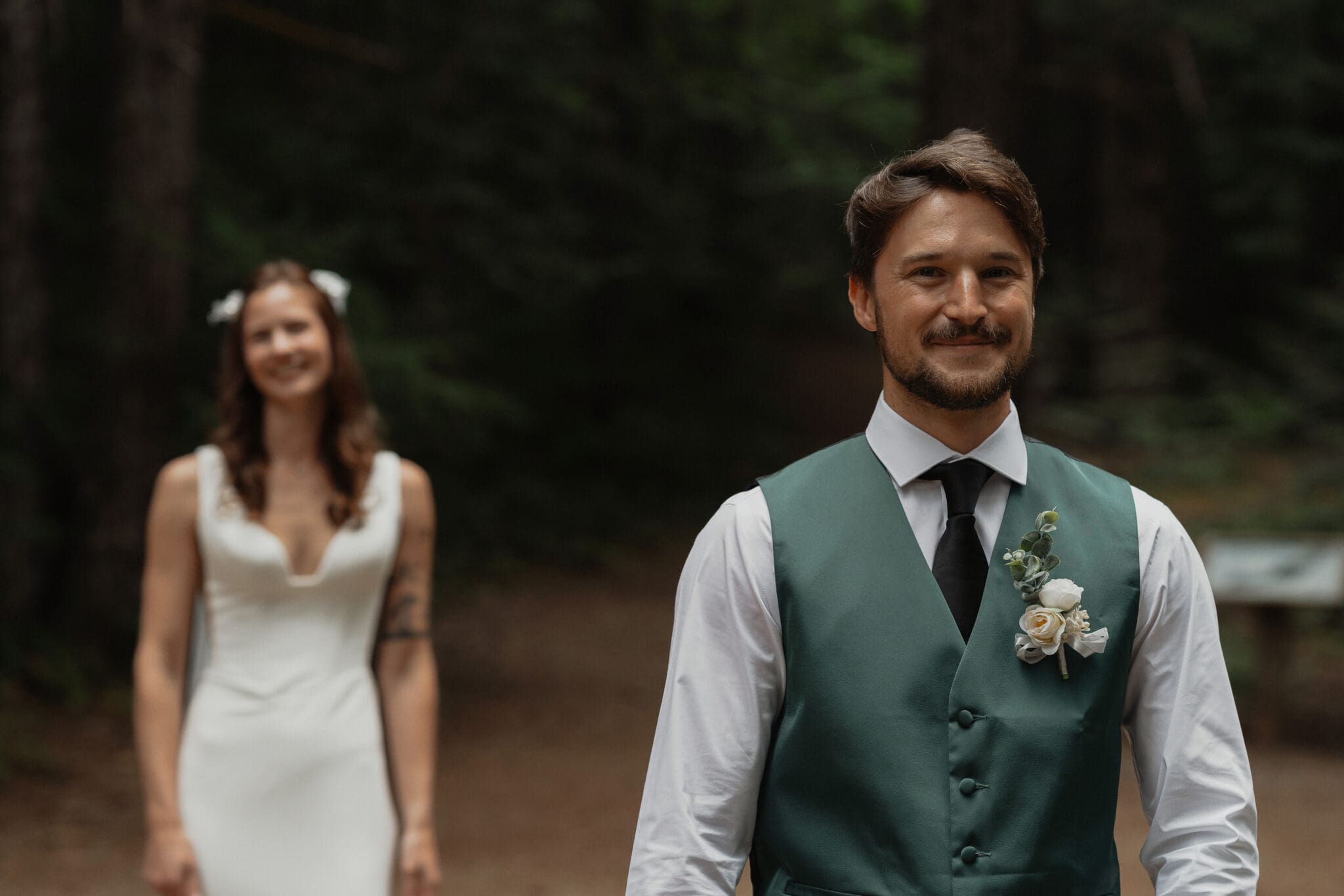 Bride and Groom during their first look at Nymph falls in Courtenay by Latitude 49 Photography
