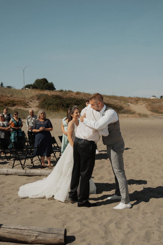 father hands off his daughter after walking her down the isle