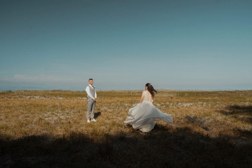 Couple being playful during wedding portraits