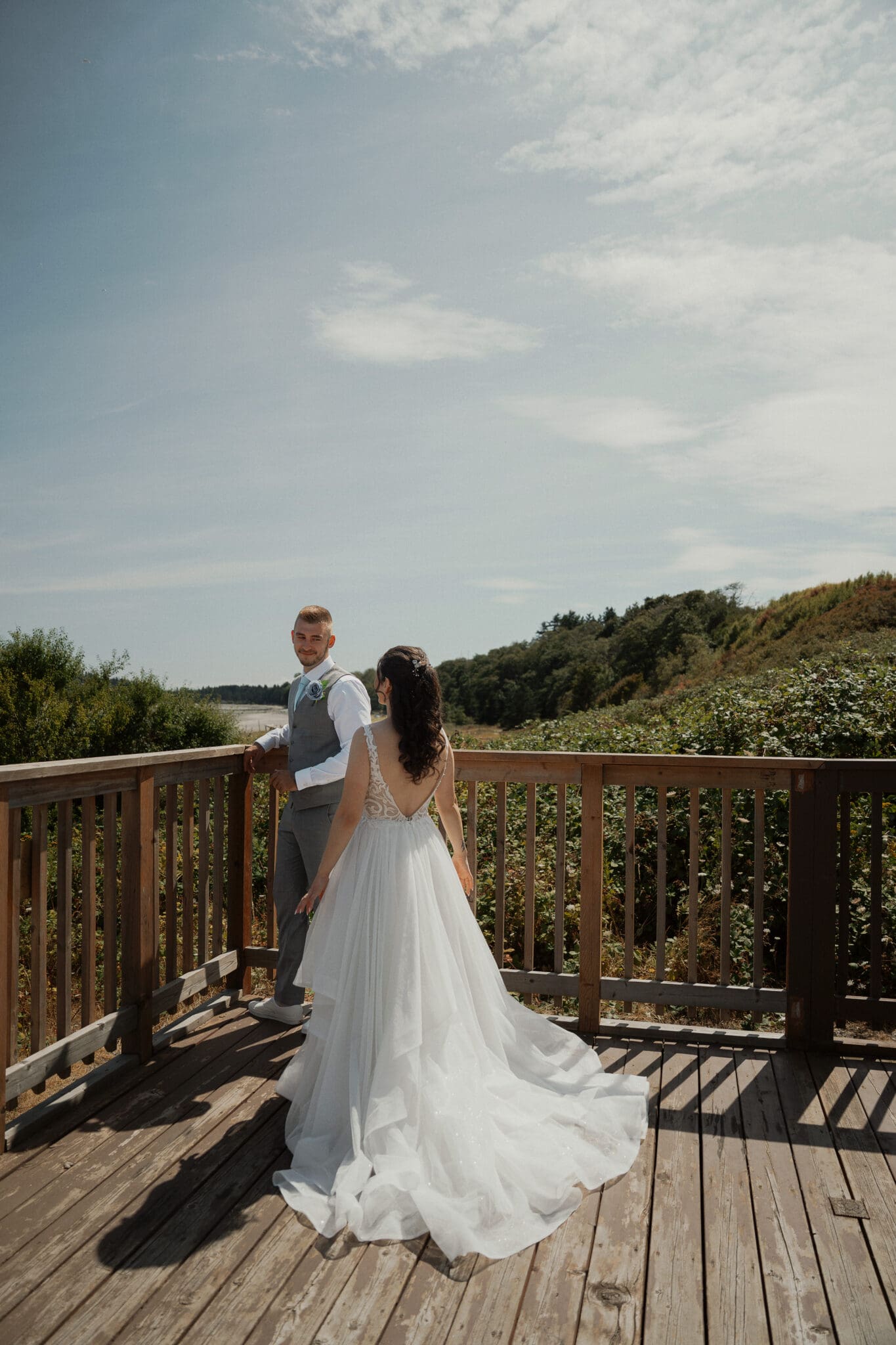 Couple during their first look at their Airforce Beach Wedding in Comox by Latitude 49 Photography