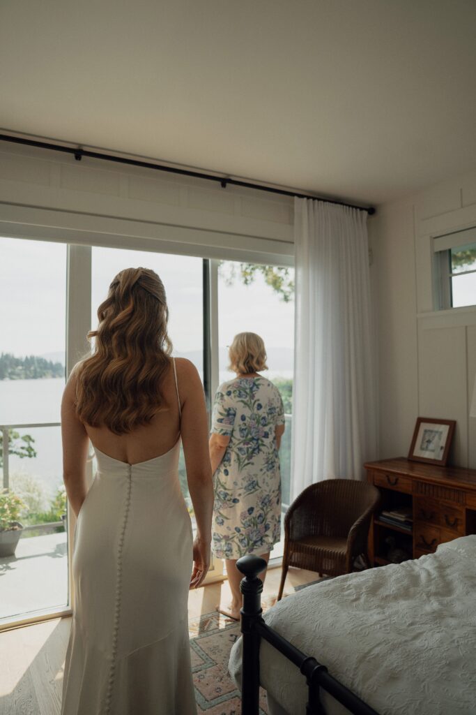 First look with mom during getting ready photos in Saanichton by Latitude 49 Photography