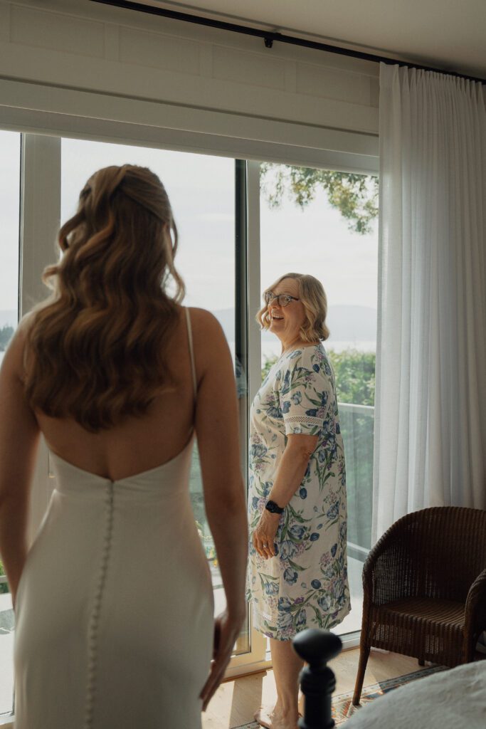 First look with mom during getting ready photos in Saanichton by Latitude 49 Photography