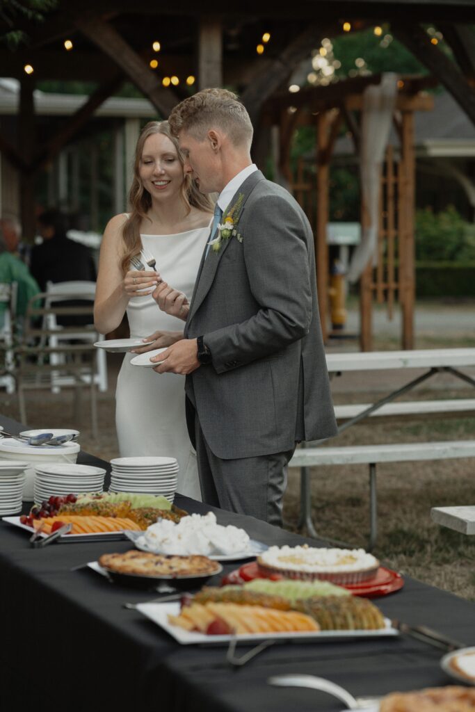 Bride and groom on their wedding day with their pies at heritage acres in saanichton by latitude 49 photography