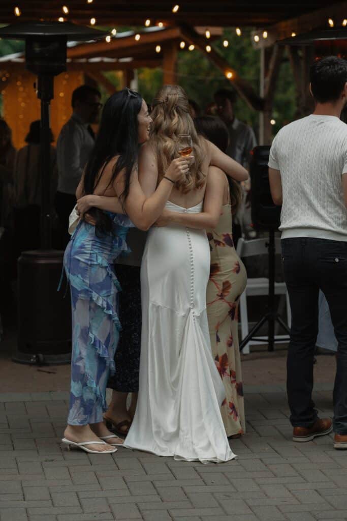 Bride and her friends on the dance floor on her wedding day at heritage acres in saanichton by latitude 49 photography