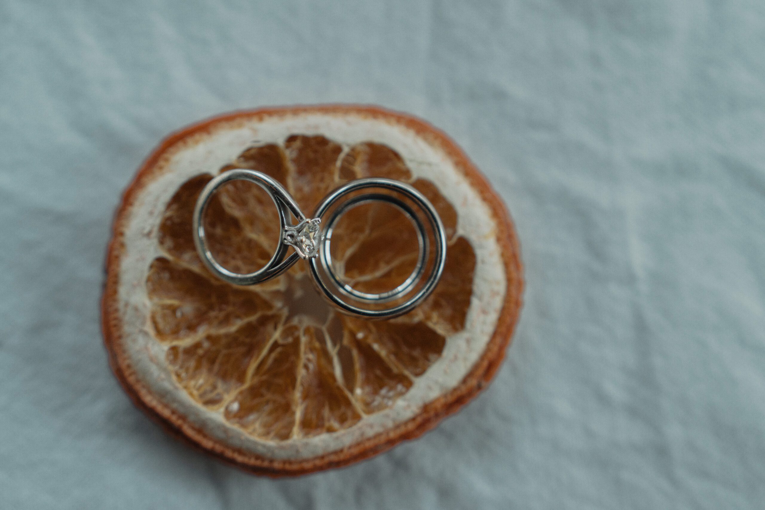 Bride and groom's rings on their wedding day at heritage acres in saanichton by latitude 49 photography