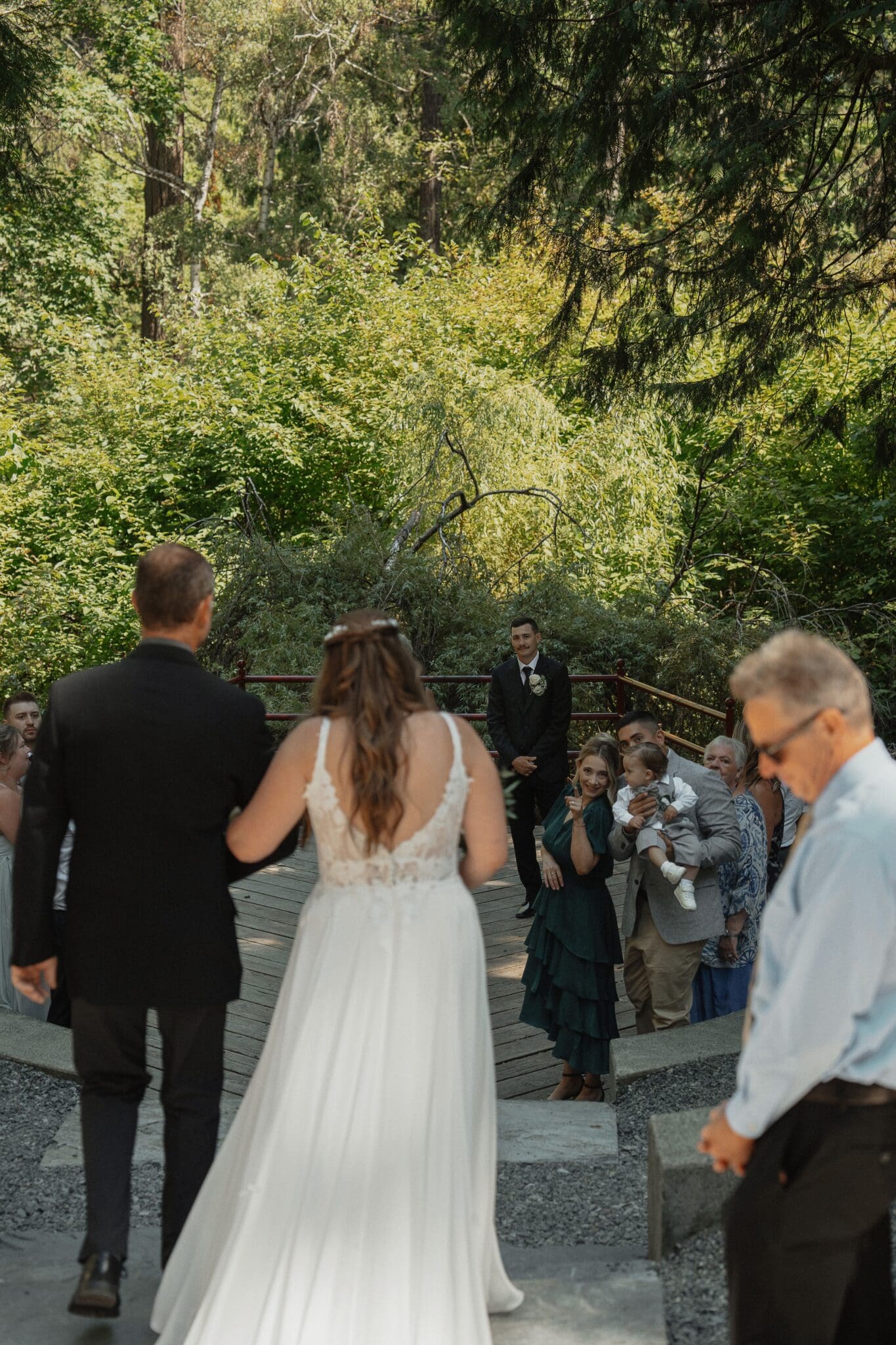 Groom sees his bride for the first time walking down the isle at their wedding in Nanaimo by Latitude 49 Photogrpahy