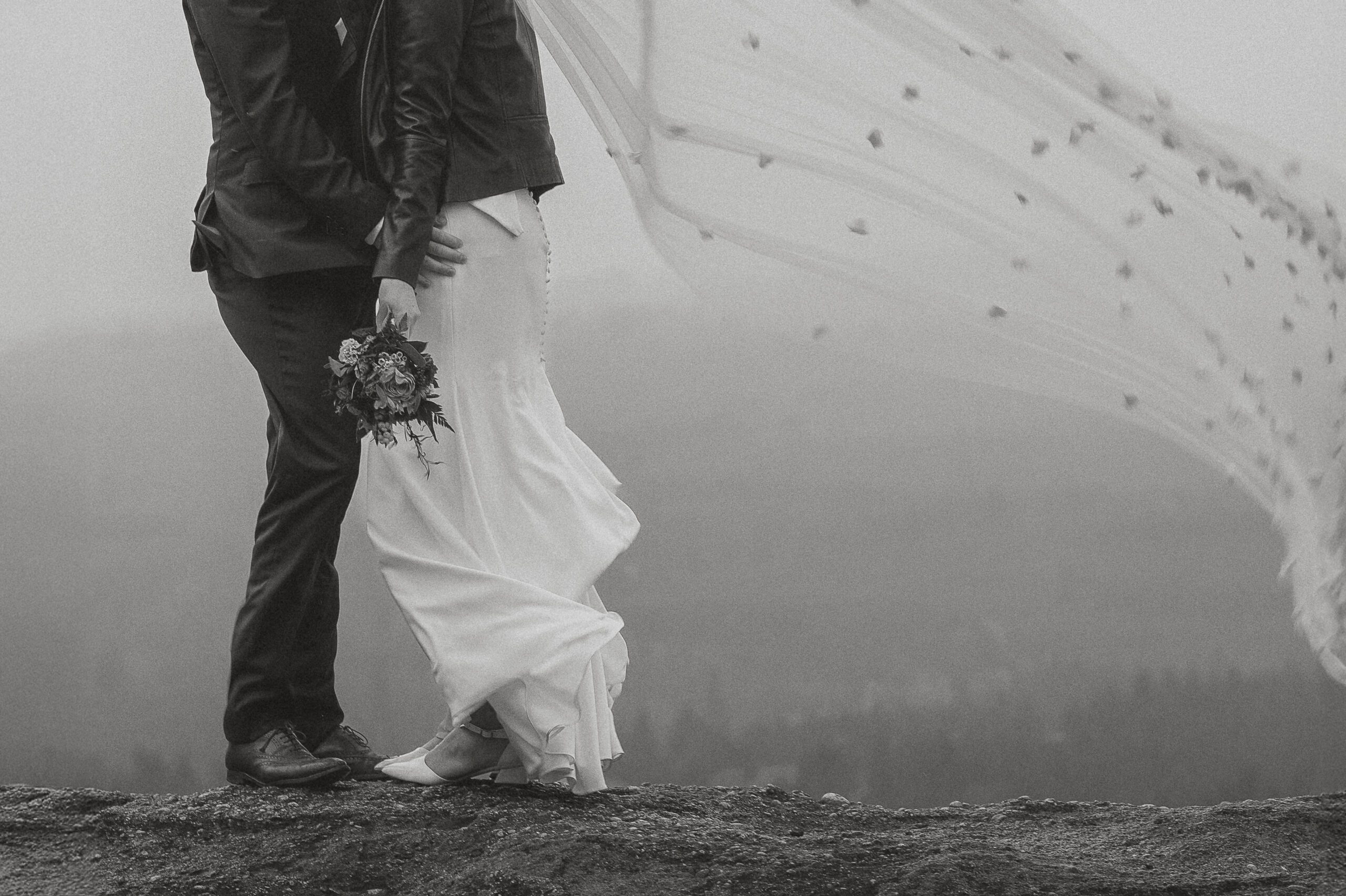 windswept wedding dress and veil by latitude 49 photography