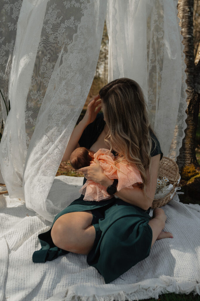 Candid Vancouver Island family photography with new mom and baby snuggling outdoors